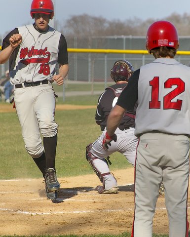 imgp83223 Wilmot's Brendon Hayden scores in front of Chris Laho's tag, Joe Felgenhauer watches the action. Dave Thoss photo