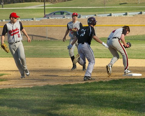 Wilmot's Jay Christian 11, flipped the ball to Qincey Berg to force Tim Clark at first. Dave Thoss photo