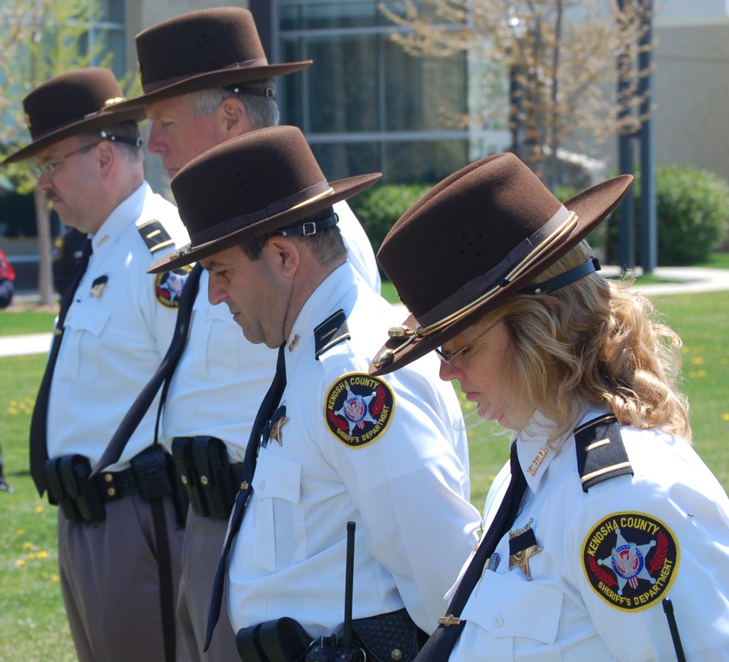 Kenosha Sheriff's Department supervisors listen as a prayer is read.