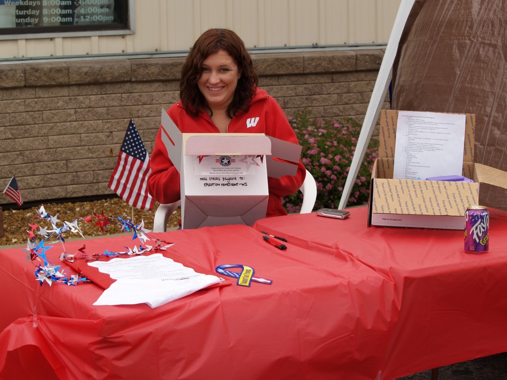 Sara Mikolajczak State Director of Programs-Operation Homefront reviews donations for Troop Care Packages
