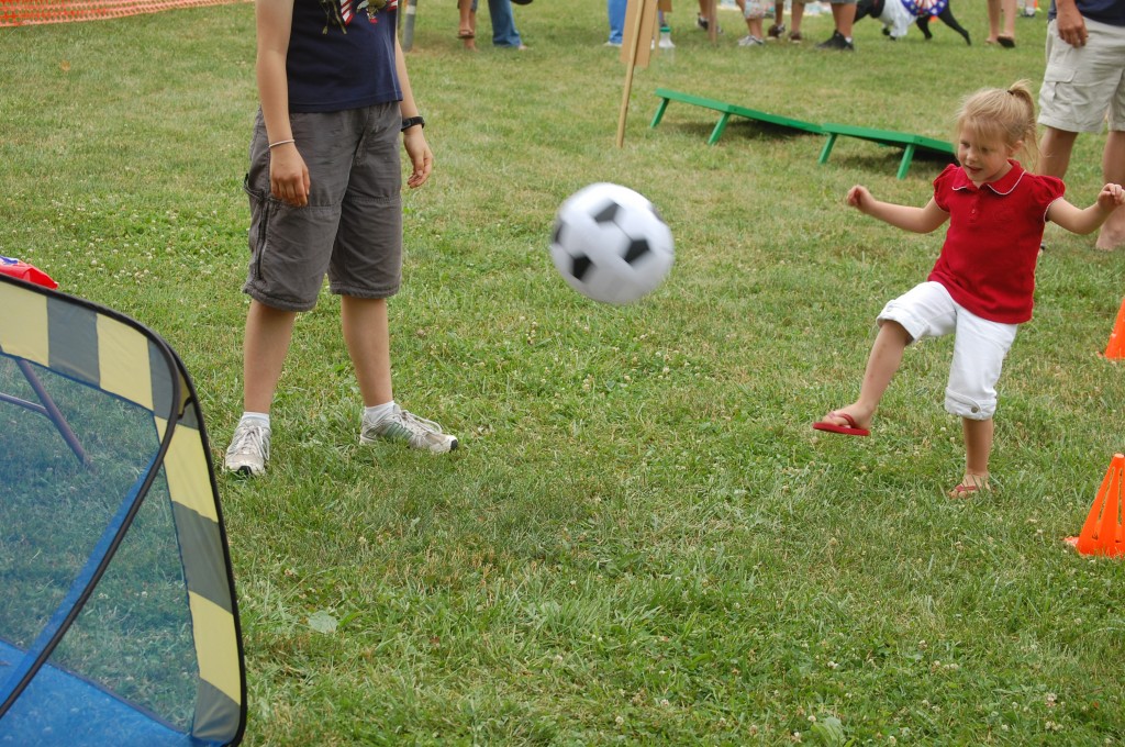 Syndie Bernier of Salem takes a kick at scoring in a soccer game. This year's festival included several children's activities in Schmalfeldt Park.