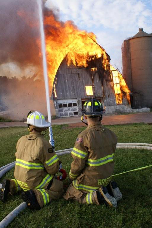 Bristol firefighters put water on the fire burning down a barn along Highway 50 as part of a training exercise Saturday./Bristol Fire Department photo by Jim Durkin