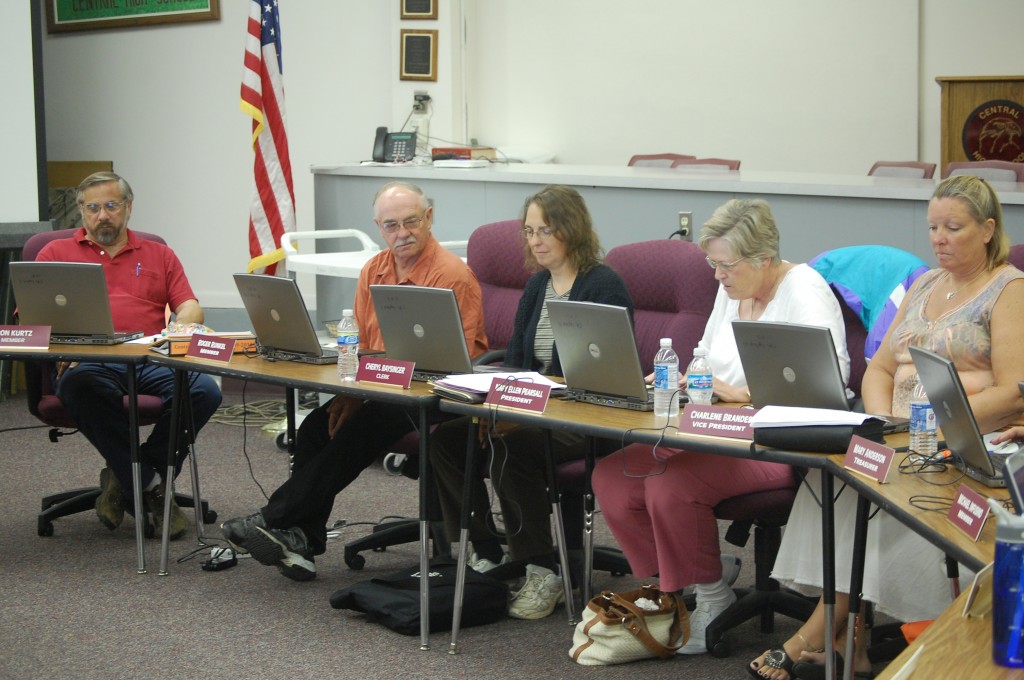Central High School Board members used computers Tuesday for their meeting materials instead of paper. It was the first time the board had tried the paperless method.