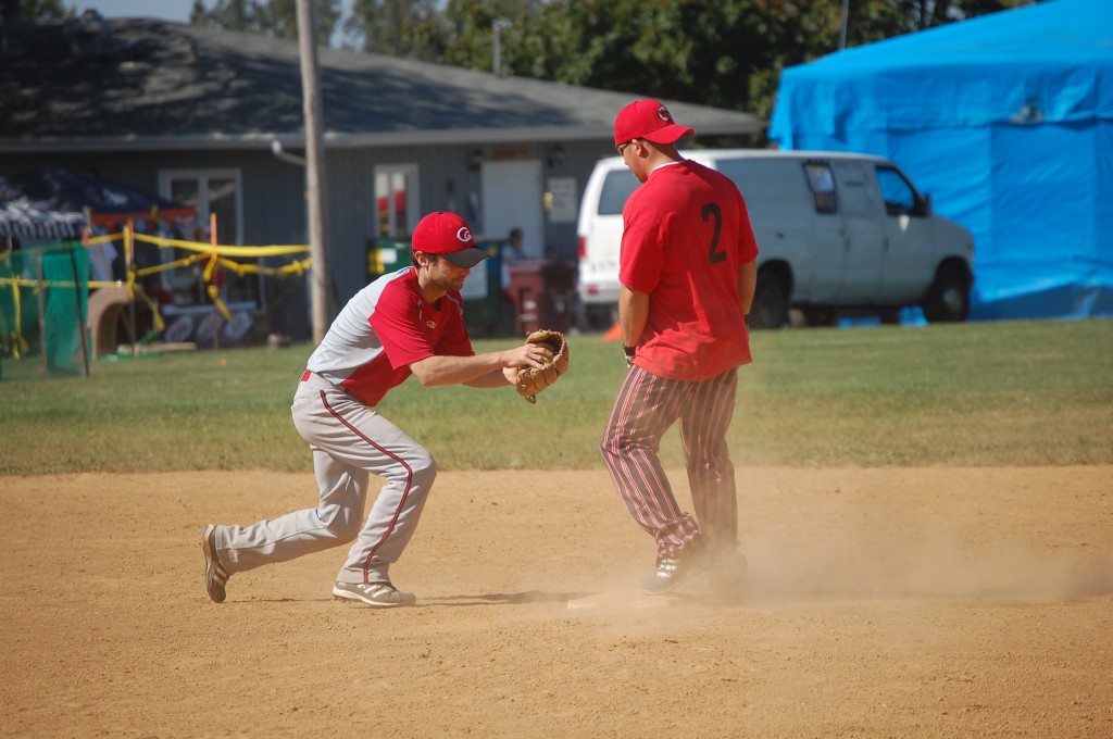 A runner from Al's beats the tag at second from a Red Dog player.