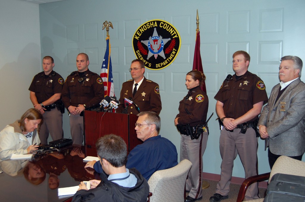 Sheriff David Beth addresses the media at a press conference Wednesday monring concerning the killing of a Brighton man during a home invasion. Around Beth are other deputies who were involved in aprehending four suspects or investigating the crime so far.