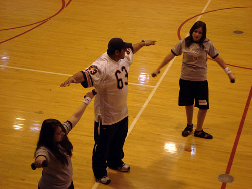 Chicago Bear Roberto Garza offered some wieght-training tips to students in a gym class at Bristol School during a visit on Tuesday. /Lisa Weiner photo