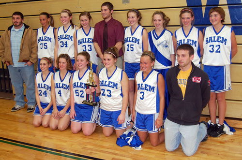 The Salem girls basketball A team poses with their coaches and tournament trophy.
