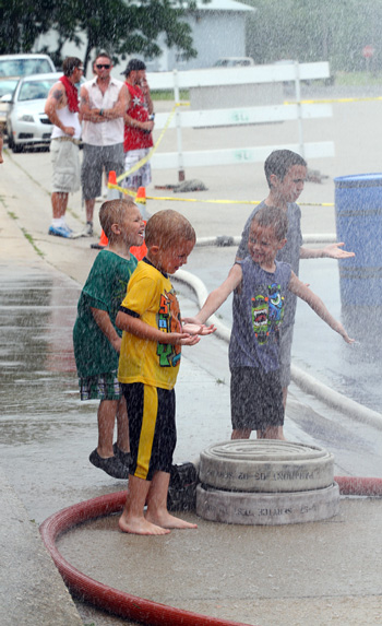 This youngster found their own way to enjoy the water fights. /Earlene Frederick photo