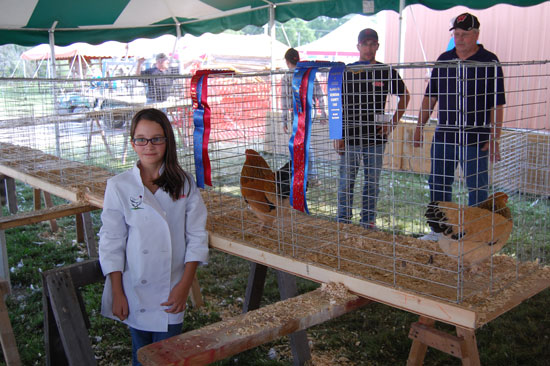 Katie Walkington and her grand champion and reserve grand champion bantams.