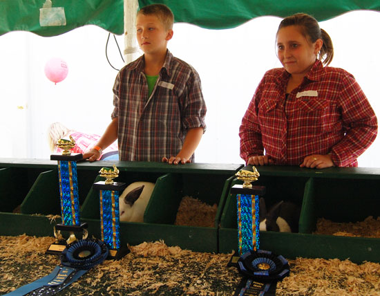 Best of show winner Matthew Knapp and best opposite of show winner Alessandro Lupo and their rabbits.