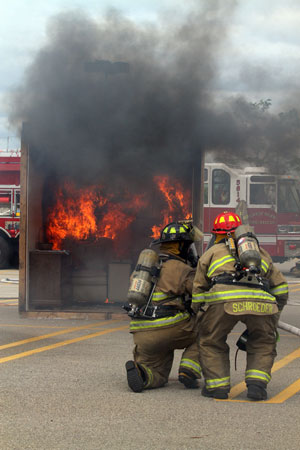 Town of Salem firefighters prepare to put out the burn room fire. /Earlene Frederick photo