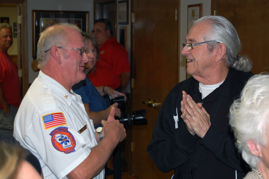 Twin Lakes Rescue EMS Chief Darrel Stoen (left) chats with Joseph Sheedy.