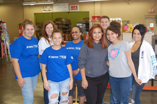 The volunteers working at The Sharing Center pose for a group photo.