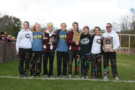 The state qualifying girls cross country team: (from left) Maddie Murphy, Joann Reiners, Maria Sabourin, Kenzie Bevery, Renee Culbertson, Becca Lamp, Melissa Capra,and Coach Keith Olsen /Nicolas Keller photo