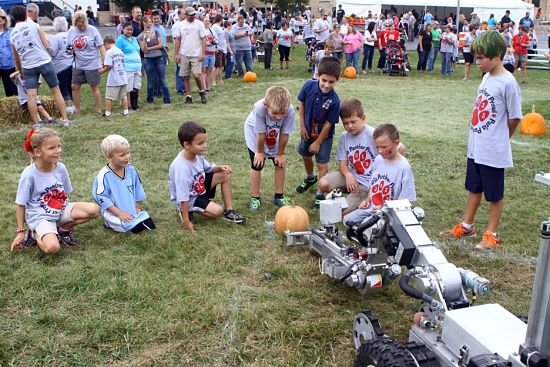 The Sheriff's Department bomb squad robot demonstrated some of its abilities with a pumpkin, right in sync with the season. /Earlene Frederick photo