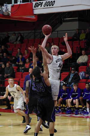 Central's Karsten shoots over Michael Roach. /David Thoss photo