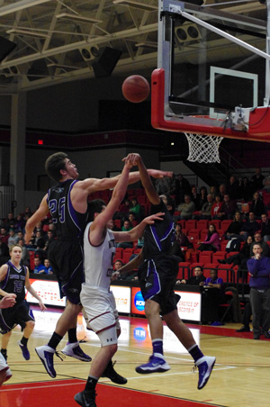 Indian Trail's Roach fouls Central guard Gilbert. /David Thoss photo