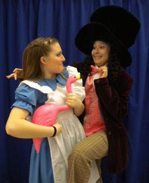 Alice, Hannah Kunce, is greeted by the Mad Hatter, Raquel Rivas, as she shows up uninvited at the Mad Tea Party. /Submitted photo