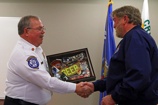 Chief Mike Slover presented Tom with a shadow box commemorating his career created by Lt. Mandy Dodge.