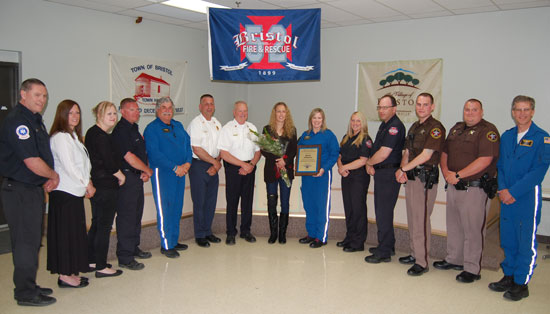 Everyone involved in the call from Bristol Fire and Rescue, Kenosha County Sheriff's Department, Kenosha County Joint Services Dispatch and Flight for Life with patient Christine Borggren in the center.