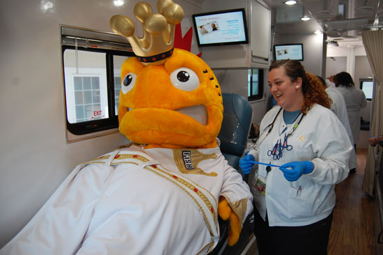 Elvis of the Kenosha Kingfish baseball team in The Blood Center of Wisconsin donation bus. His donation was type-cold.