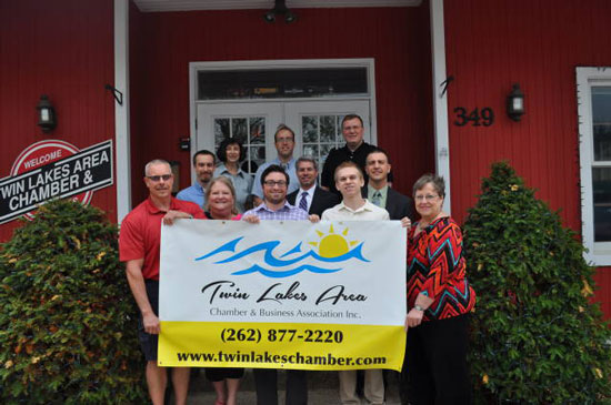 (Front row from left) Jim Little, Minuteman Press; Diane Lindstrom, Keller Williams Realty; Travis Wetzel, WUHS; Adam Fitzgerald; Marilyn Trongeau, Chamber Director; (Second row from left)  James Pittman, Discover Acupuncture; Patrick DeMoon, Attorney; Randy Sherwood, First Merit Bank; (Back Row from left) Barbara Goodnough, Shorewest Realtors; Chris Brown, Slades Corners Computer Repair; Brian Hochschild, Bahr &Kadlec CPA./Submitted photo