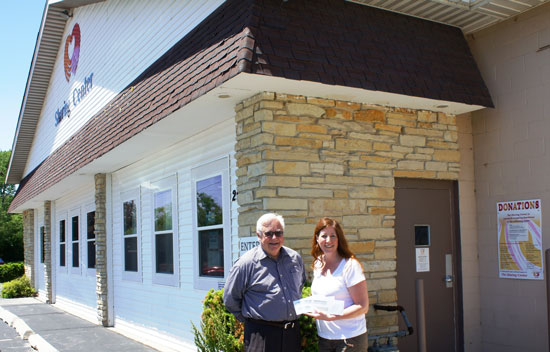 Community Foundation Executive Director Robert Schneider with Sharon Pomaville of the The Sharing Center. The Sharing Center received grants from the Foundation’s Women’s Fund, OMC Legacy Fund and unrestricted funds. /Contributed photo