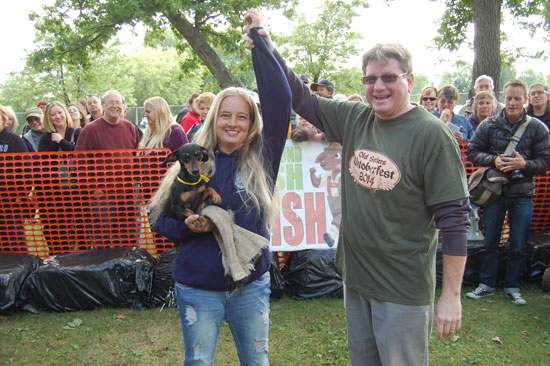 2014 Old Settlers Oktoberfest Dachshund Dash winner Ellie, her trainer Michelle Schroeder and County Executive Jim Kreuser.