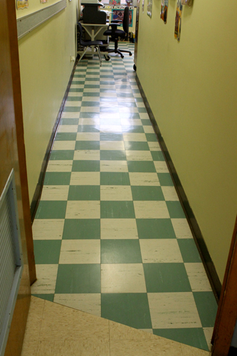 The doorways would be squared and made ADA compliant. The asbestos tile would be removed and replaced. 
