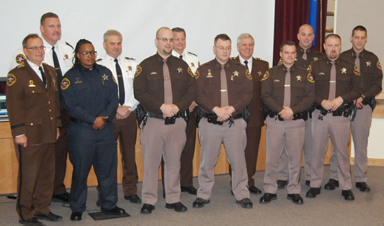 Sheriff David Beth, all of the awardees present and representatives of the command staff pose for a photo after Friday's ceremony.