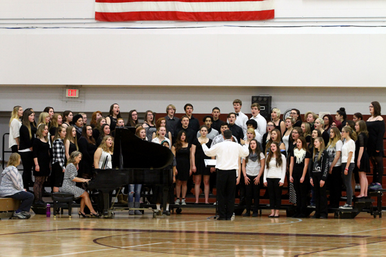 The choirs sang "The Star Spangled Banner" and "God Bless America".