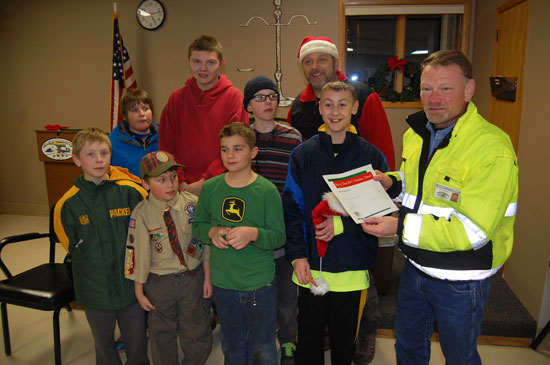 Village President Terry Burns presents first place to Cub Scout Pack 328 and Boy Scout Troop 329.