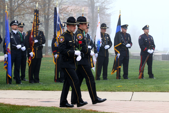 Presenting the flower and ribbon in memory of Deputy Frank Fabiano. He was shot in the line of duty 9 years ago, today. 