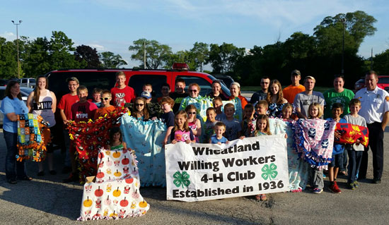 Members of the Wheatland Willing Workers with Tom Smith of the Twin Lakes Rescue Squad. /Submitted photo