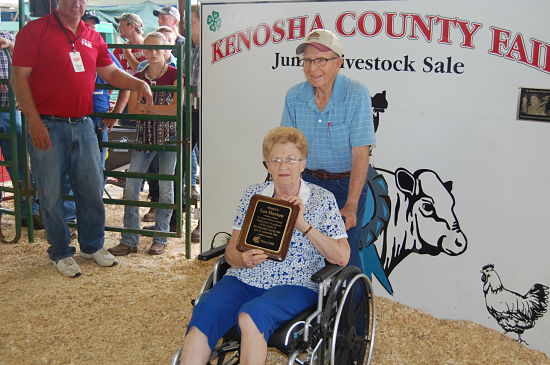 Lee Horton (standing) was recognized at the start of the auction for his many years of service to the Kenosha County Junior Livestock Sale.