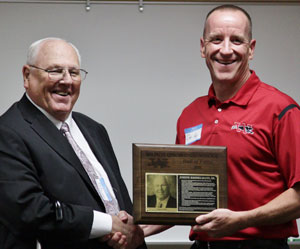 Joseph Riesselmann Sr. (left) and WUHS district administrator Dan Kopp.